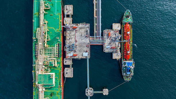 istock Aerial view lpg tanker ship vessel loading and unloading in oil terminal refinery, Global business import export logistic transport sea freight cargo lpg tanker ship, LPG tanker ship at port, Liquefied petroleum gas. 2224408524