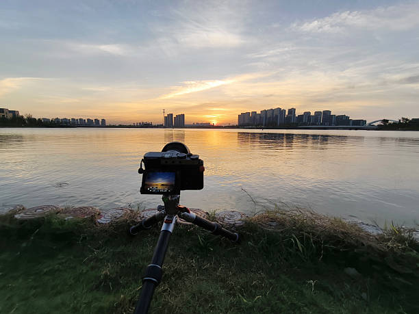 istock camera on a tripod shooting the sunset 2224412086