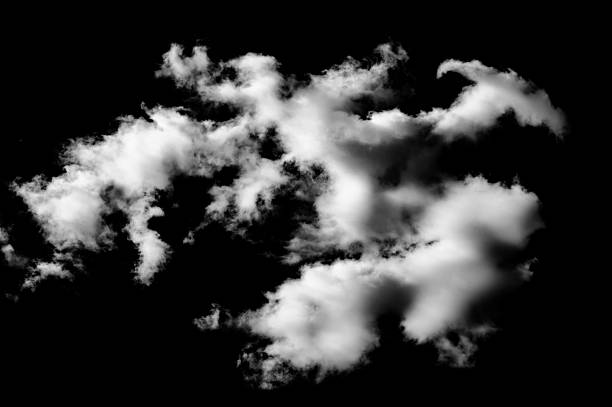 A single, dense cloud formation hovers in a pitch-black sky, its soft edges glowing in the light. The image’s stark contrast and minimalism evoke a surreal, contemplative mood. The fluffy cloud details create a sense of floating and lightness in an otherwise dramatic composition.