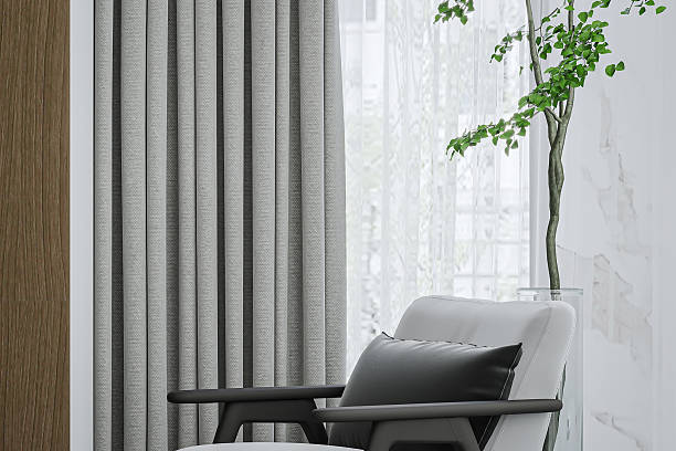 istock Cozy Reading Nook-Modern Armchair, Soft Curtains, and Greenery by Window 2224417902