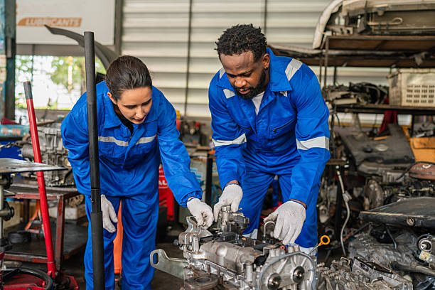 istock Team Auto mechanic are checking and repair maintenance auto engine 2224418217