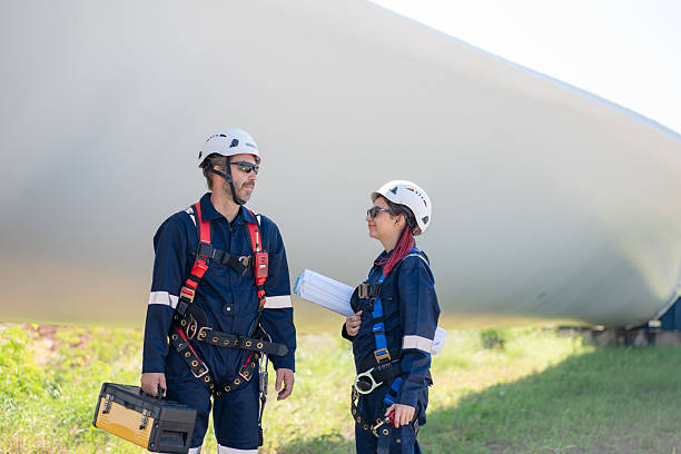 istock Engineer team working in wind turbine farm. 2224418480