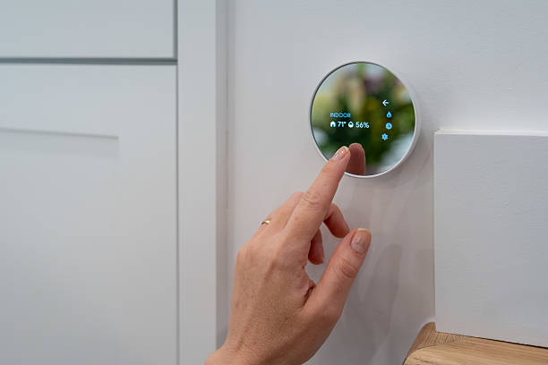 istock Modern Smart Thermostat Control in a Contemporary Home 2224420060