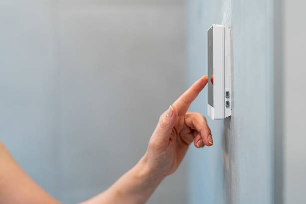 istock Modern Smart Thermostat Control in a Contemporary Home 2224420065
