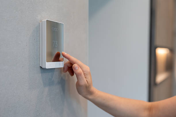 istock Modern Smart Thermostat Control in a Contemporary Home 2224420208