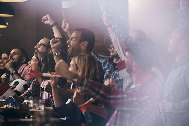 istock Celebrating match victory in a pub! 2224421741