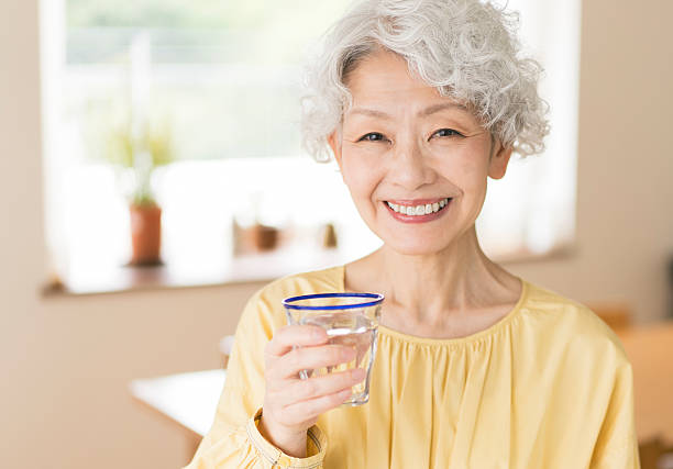 istock Gray-haired Japanese woman drinking water 2224422945