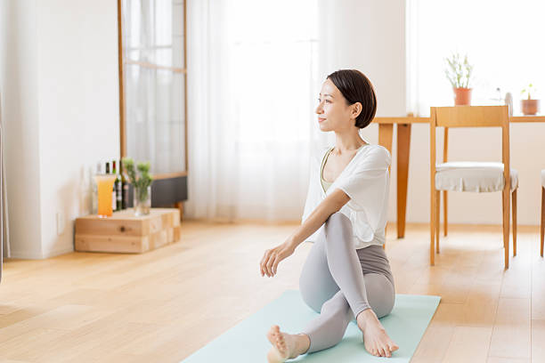 istock Japanese woman doing stretching (yoga) at home 2224422994