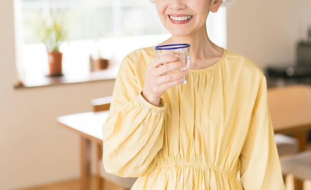 istock Gray-haired Japanese woman drinking water 2224423023