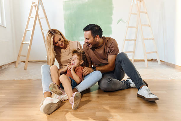 istock Cheerful family having fun during home renovation process. 2224423117