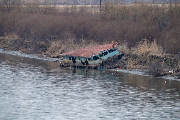 istock an old barge stranded at the foot of a river. 2224424938