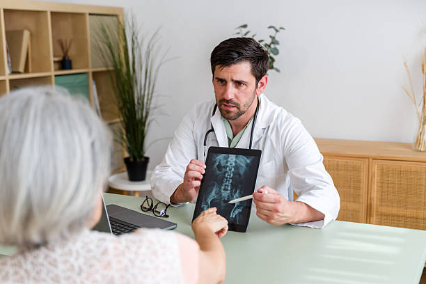 istock Doctor Explaining X-ray Results to Patient 2224433563