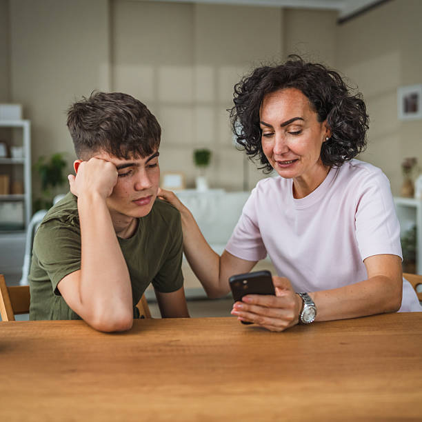 istock talk mother support and solving problem together with teenage boy son, share experience and opinion 2224436850