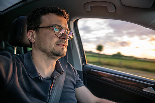 istock Man driving fast. Motion blur on highway. Sunset travel. 2224439761