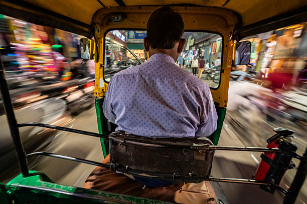 istock Indian man drives auto rickshaw (tuk-tuk), India 2224441757