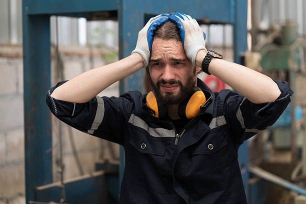istock Industry factory, male worker, workshop. Male worker tired from working, looking streesed, feeling sice or unwell in place of work at factory 2224443895