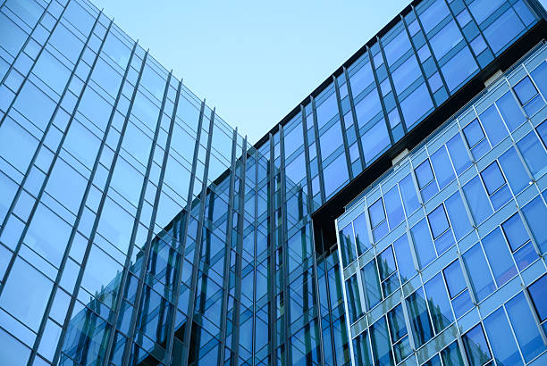Glass skyscrapers with blue reflection and futurristic perspective