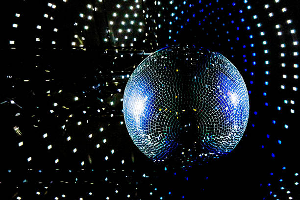 Disco Ball Reflecting Blue and Purple Light. Party, Dance Event, or Nightclub Atmosphere. Copy Space.
