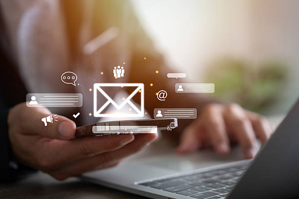 istock Digital marketers use email marketing tools on their laptops and smartphones to send out newsletters. 2224450608