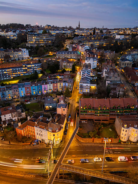 istock Bristol skyline illuminating at dusk, with traffic flowing below 2224452103