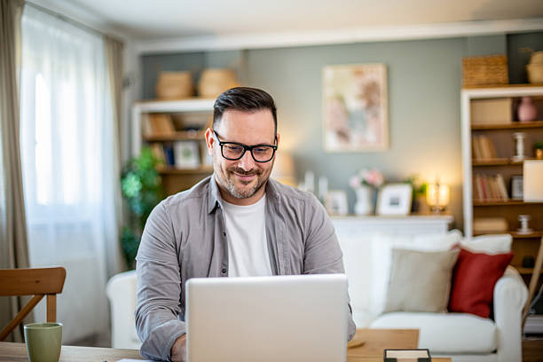 istock Happy man working remotely from his home office 2224452946