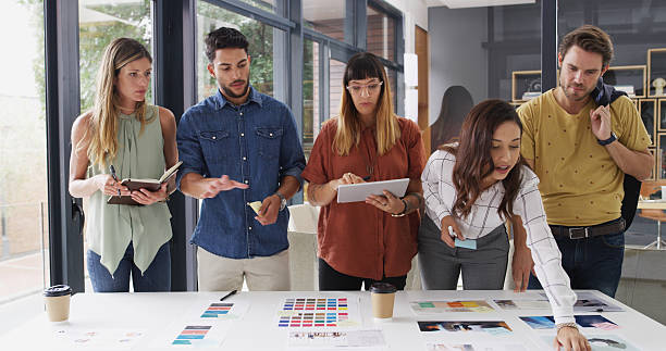 istock Business people, teamwork and tablet with planning, creative company and brainstorming. Group, employees and graphic designers with cooperation, solution and tech with color for proposal or feedback 2224455153