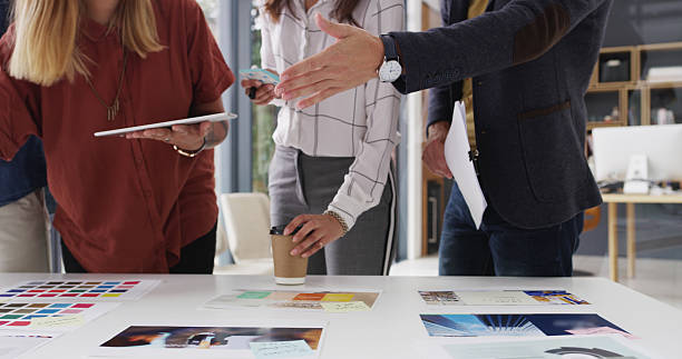 istock Creative, meeting and hands of people with tablet pointing for planning, collaboration and teamwork. Web design, business and workers with notes, color palette and digital tech for project layout 2224455192