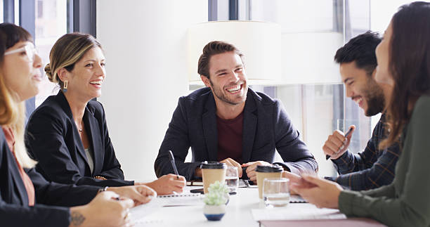 istock Man, group and meeting with discussion in office with notes, planning or strategy at media company. People, journalist and editor with problem solving, happy and team with feedback at startup agency 2224455907
