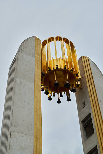 A striking and beautiful golden architectural structure set against a visually appealing cloudy sky