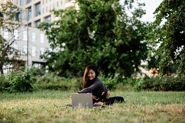 istock Online yoga class at park 2224457051