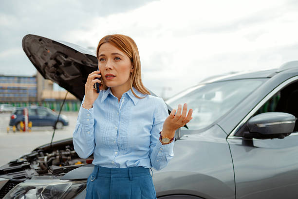 istock Worried Woman Calling Mechanic to Explain Car Problem – Roadside Breakdown and Emergency Help 2224457330