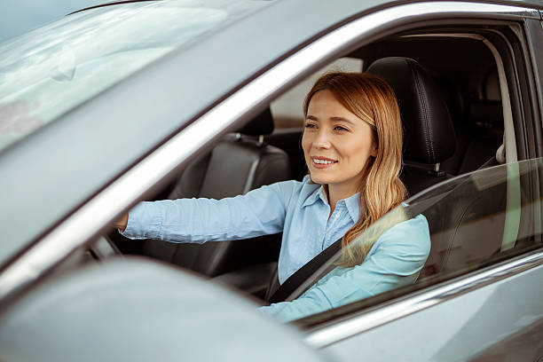 istock Confident Young Woman Driving Car 2224457340