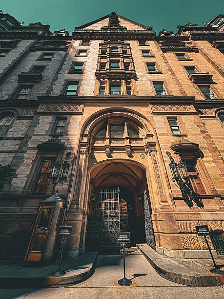 Exterior shot of the Dakota building in New York. Shot mid-afternoon in July showcasing the dramatic impact of the high afternoon sun on the iconic building.
