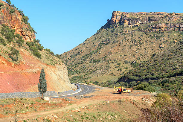 Ha Hlosi, Lesotho - May 4, 2025: Construction equipment next to road B16 at Ha Hlosi in Lesotho, as seen accross the Caledon river from South Africa