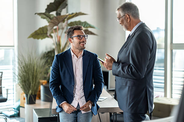 istock Senior executive smiling during business meeting 2224460609