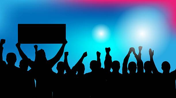istock Silhouettes of a Crowd at the Concert or Disco Colorful Background 2224462174