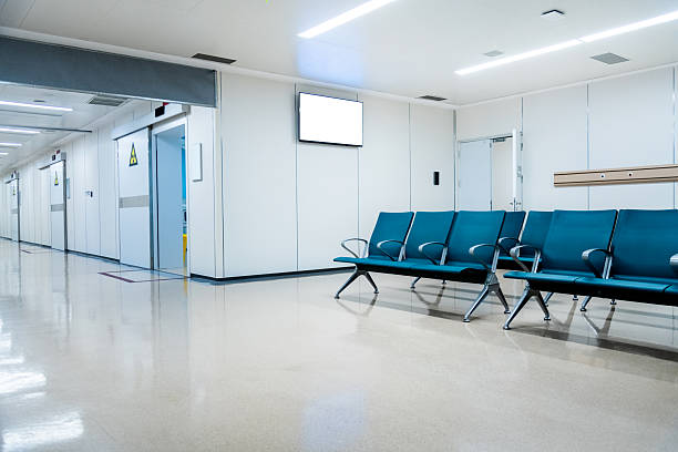 Empty chairs in modern hospital waiting room