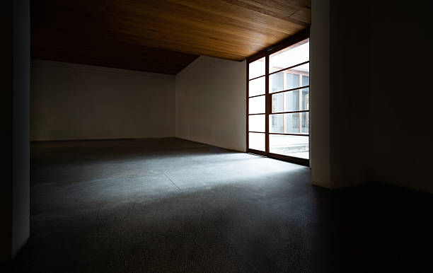 istock Empty room interior with concrete floor and wood ceiling 2224463953