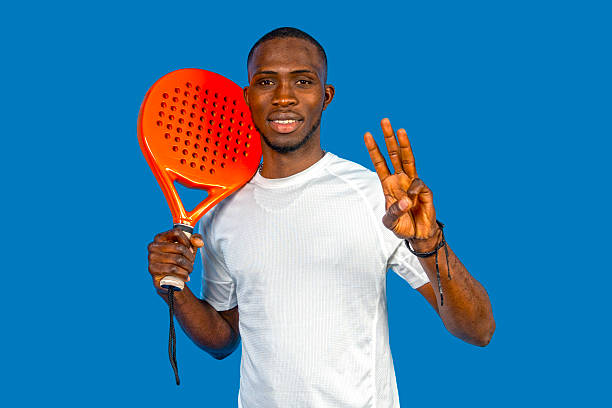 istock Padel player showing number three with fingers and holding racket 2224465129
