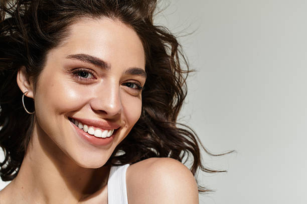 istock Beautiful woman with elegant makeup posing gracefully in studio setting 2224466240