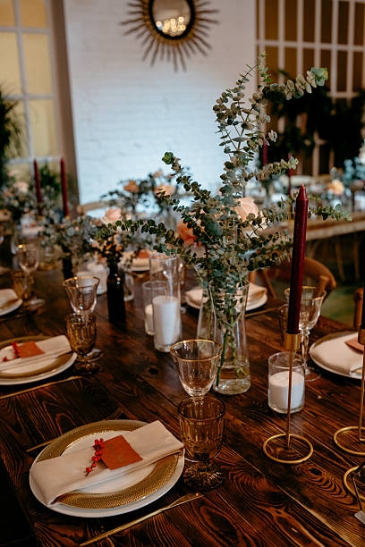 istock Elegant rustic dinner setting with eucalyptus decor and candles in a cozy ambiance 2224466951