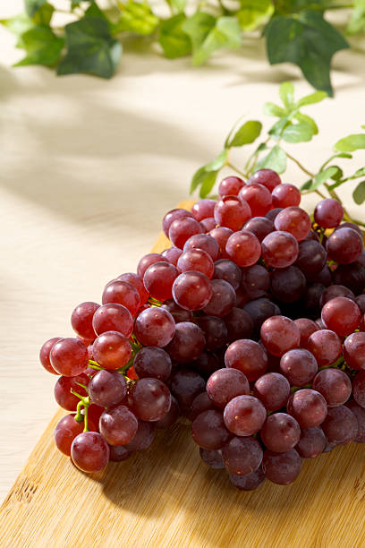 istock Fresh Delaware Grapes on Wooden Cutting Board 2224467276