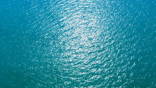 istock Aerial view of sun reflection on blue ocean surface 2224467387
