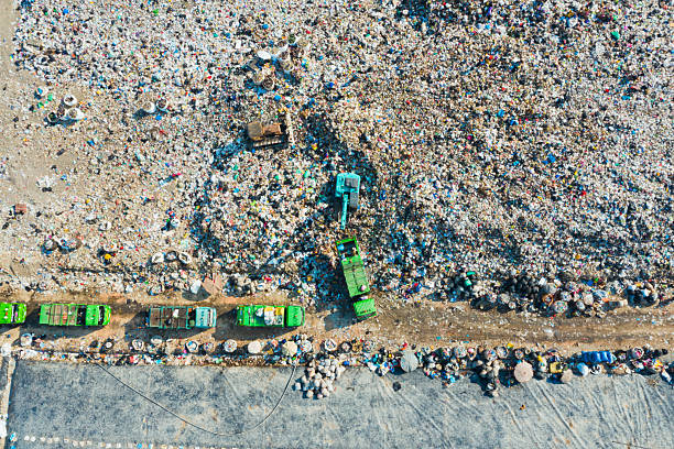Trucks unloading garbage