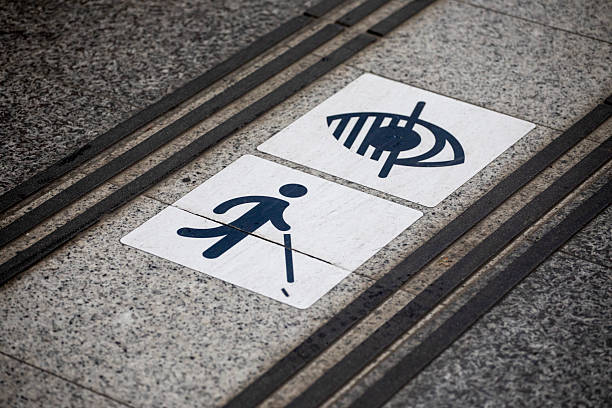Tactile paving, also known as detectable warning surfaces or tactile ground surface indicators, designed to assist visually impaired pedestrians shown here at Lille-Flandres station