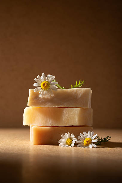 istock Stack of handmade organic soap bars decorated with fresh chamomile flowers 2224470733