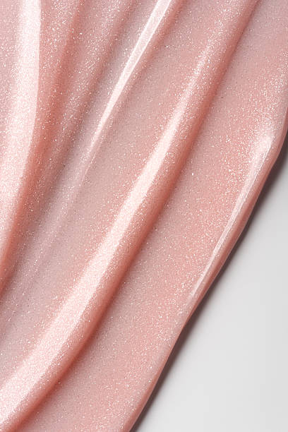 istock Shimmer pink or beige cosmetic texture with smooth flowing lines 2224470844
