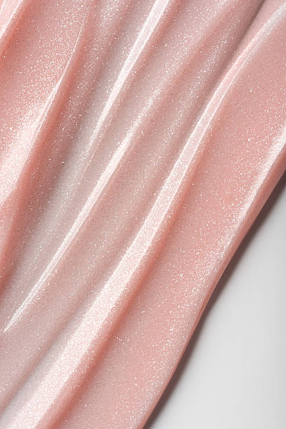 istock Shimmer pink or beige cosmetic texture with smooth flowing lines 2224470845