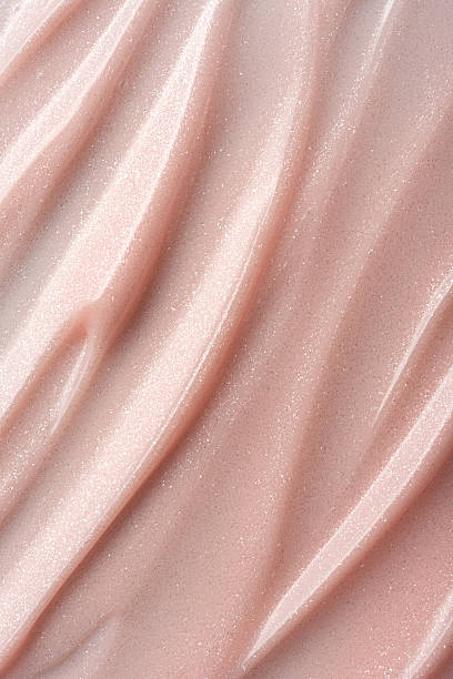 istock Shimmer pink or beige cosmetic texture with smooth flowing lines 2224470875