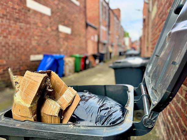 A full garbage bin in a back alley at Blyth in Northumberland